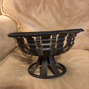 This object is a vintage Brutalist-style wrought iron fruit bowl.